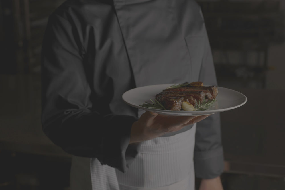 A chef plating a dish