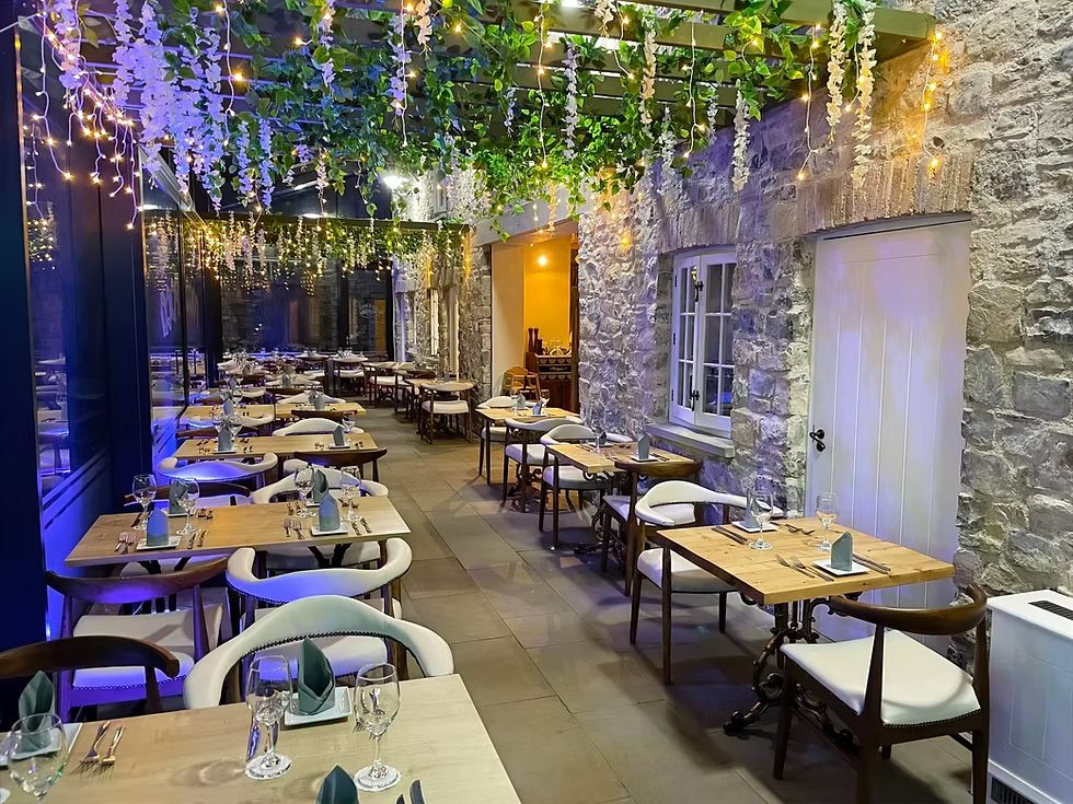 The covered terrace, set for dinner